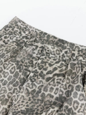 Leopard print cargo pants with button fly and utility pockets.
