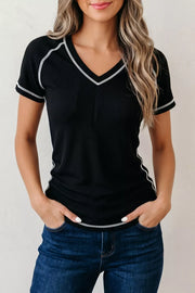 Black waffle knit v-neck tee with contrast white stitching and short sleeves