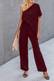 Burgundy asymmetric drape-sleeve wide-leg jumpsuit with elastic waist
