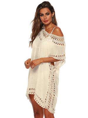 White kaftan cover-up with crochet trim and off-the-shoulder neckline.