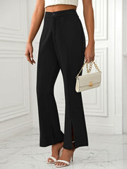 Black tailored flare trousers with split hems and a high waist.
