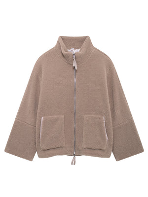 Tan sherpa jacket with stand collar, zip front, and two patch pockets.