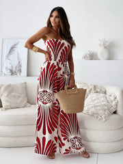 Strapless wide-leg romper in cream with red tribal print, smocked bodice, and wide legs.