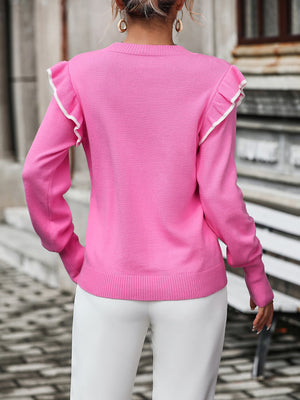 Pink crew neck sweater with contrast trim ruffle shoulders and ribbed hem.