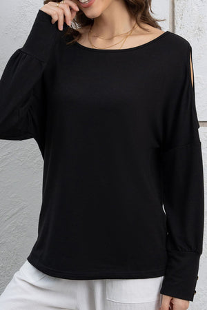 Black long sleeve top with shoulder cutouts and button cuffs