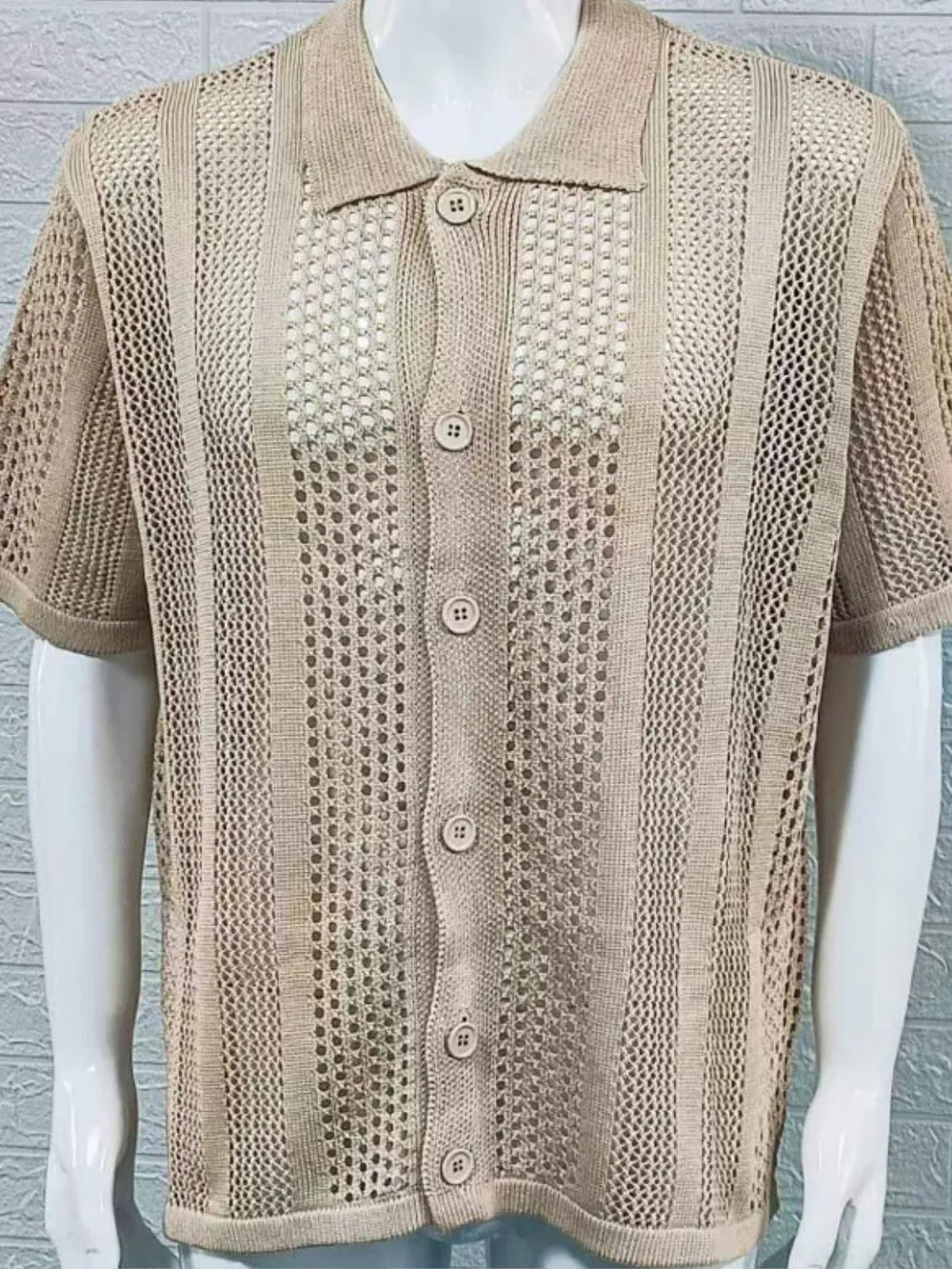 Beige open-knit resort shirt with short sleeves and button front.