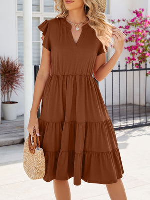 Brown ruffled midi dress with notched V-neck and tiered skirt.