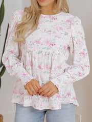 Blush pink floral print blouse with smocked waist and cuffs
