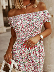 White off-shoulder midi dress with a smocked bodice and a pink floral print.