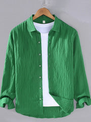 Green textured long sleeve button-up overshirt with classic collar and white t-shirt underneath.