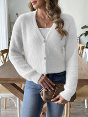 White plush button-down cardigan with pearl details and V-neck.