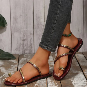 Burgundy thong sandals with metallic trim and toe ring detail.