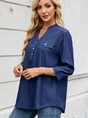 Dark navy denim henley blouse with V-neck, button placket, and two chest pockets.