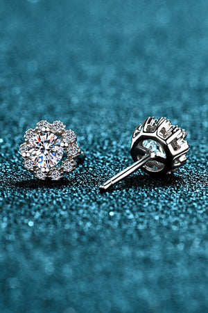 Floral halo stud earrings in silver, 925 sterling silver, with a central gem and surrounding smaller gems.
