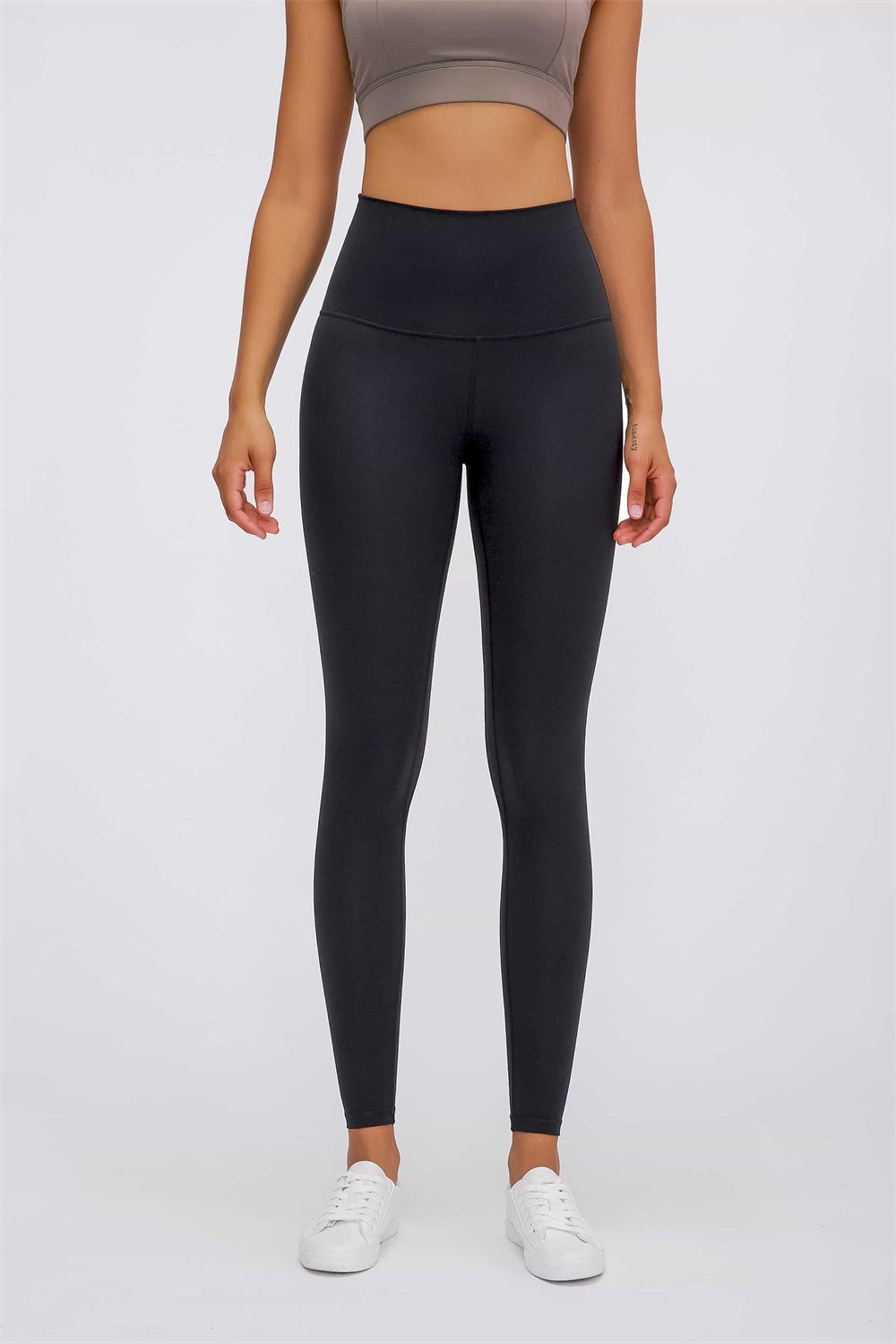 Black high rise leggings with a smooth finish and full length.