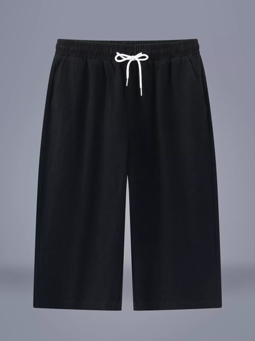 Black relaxed fit cropped sweatpants with drawstring waist and pockets.