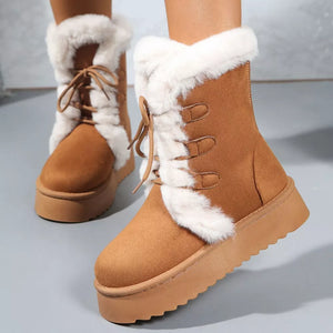 Brown suede lace-up platform boots with white faux fur trim and lug sole.
