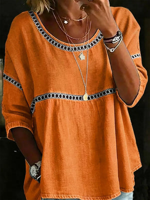 Orange bohemian t-shirt with openwork trim and scoop neck.