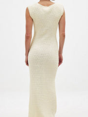 Scoop neck midi knit dress in apricot with a ribbed texture and sleeveless design.