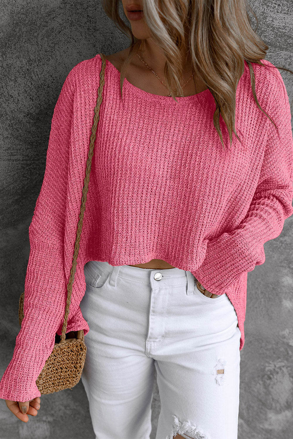 Strawberry acrylic knit slouch top with wide neckline and long sleeves.
