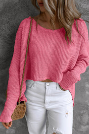Strawberry acrylic knit slouch top with wide neckline and long sleeves.