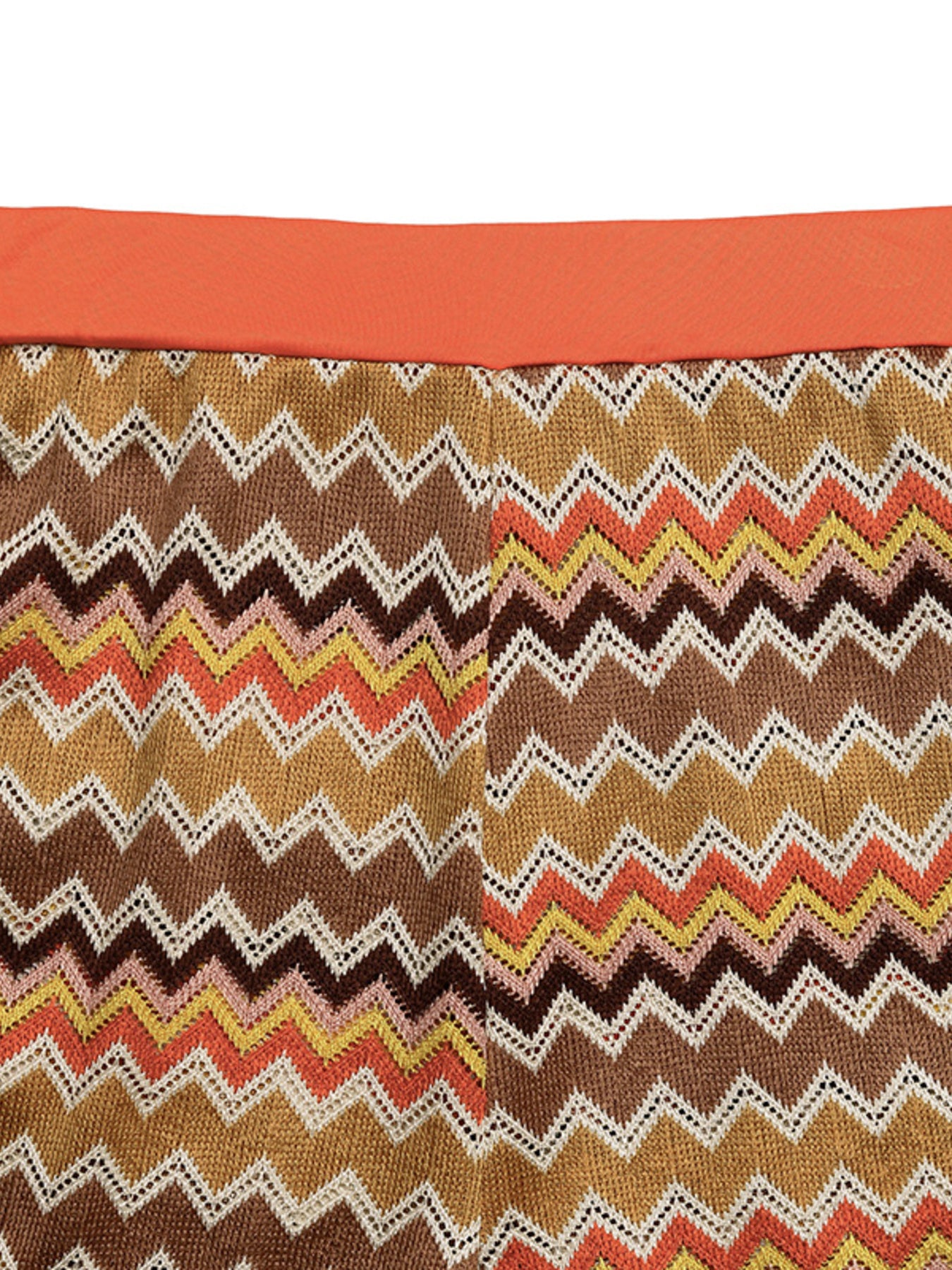 Zigzag knit two-piece set with orange waistband and multicolor chevron pattern.