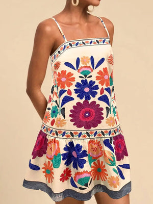 Vibrant floral print mini dress with square neckline and spaghetti straps in beige.