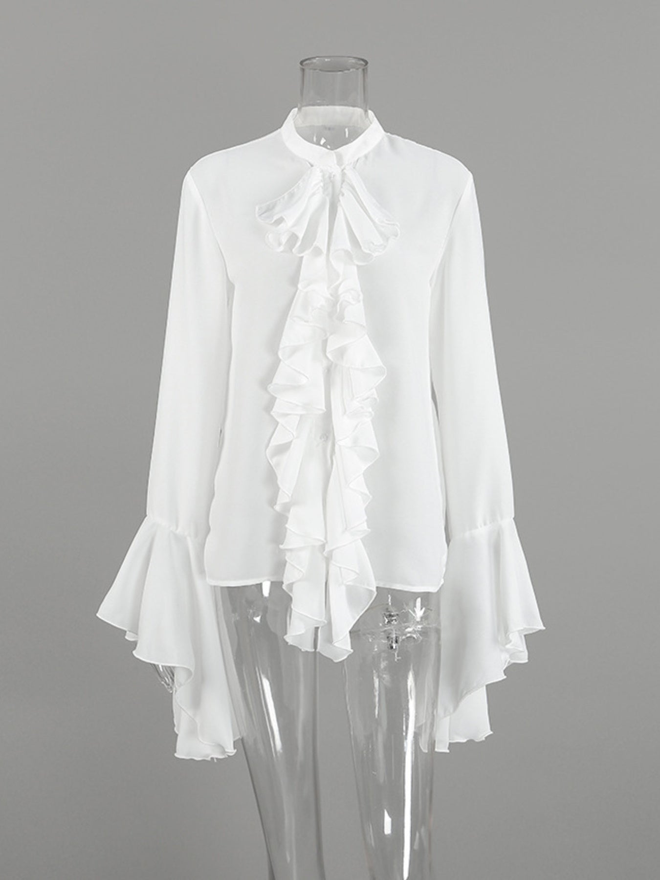 White ruffled flounce sleeve blouse with a high neckline and buttoned front.