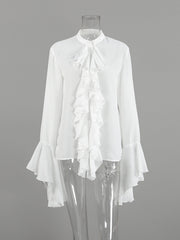 White ruffled flounce sleeve blouse with a high neckline and buttoned front.