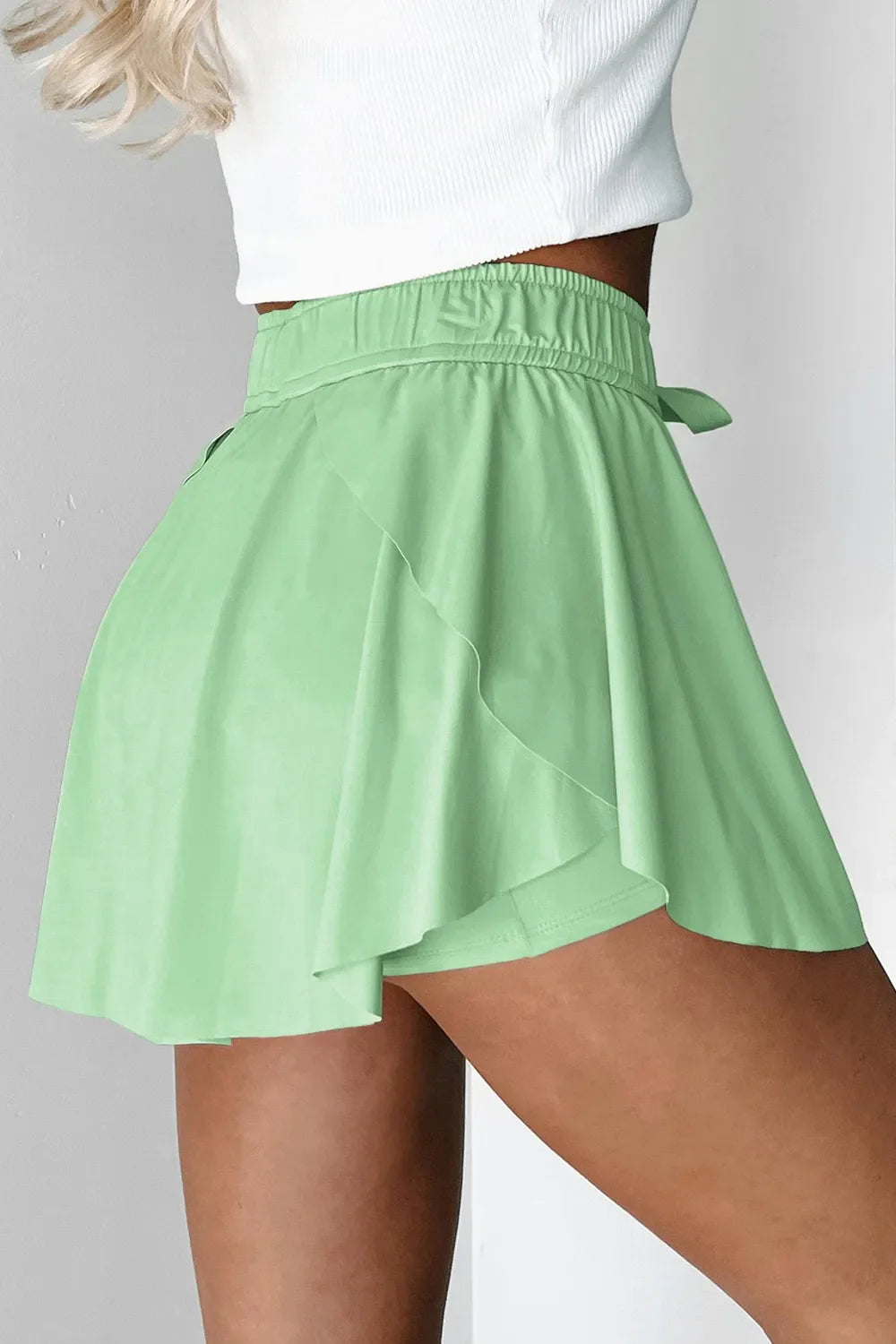 Flared skort in Gum Leaf with elastic waist and tie detail, A-line cut.