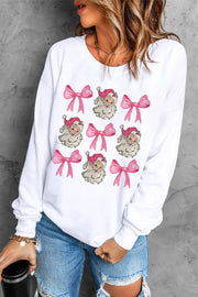 White crewneck sweatshirt with a repeating pattern of Santa Claus faces and pink bows.