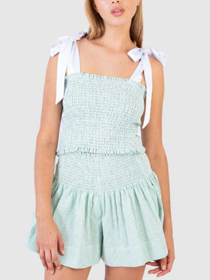 Light green smocked bodice and skirt set with white tie straps and pinstripe pattern