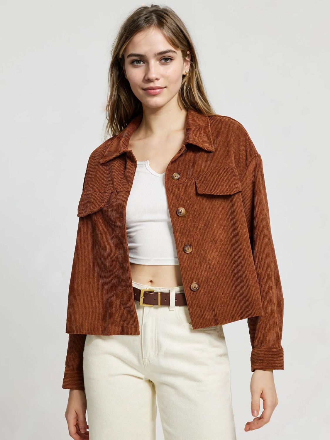 Brown corduroy utility jacket with buttoned patch pockets and collar.