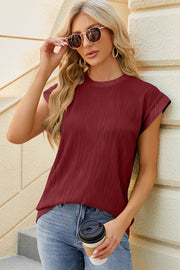 Burgundy textured cap sleeve top with a round neckline.