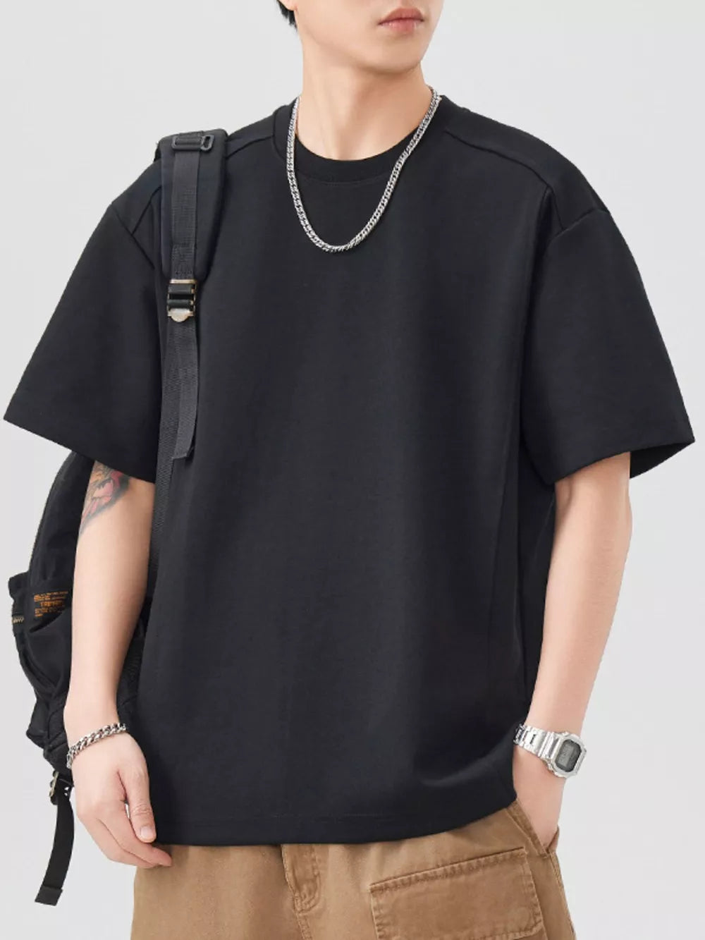Black oversized cotton blend men's t-shirt with crew neck and short sleeves.