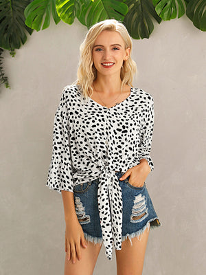 Spotted knot-front blouse with flared sleeves and v-neck