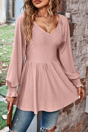 Blush pink textured empire waist blouse with shirred sleeves and V-neck