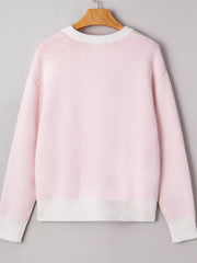 Blush pink knit sweater with white trim and ribbed hem.
