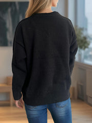 Black oversized knit cardigan with button front and crew neck, acrylic material