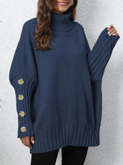 Dark blue turtleneck sweater with button cuff detail and ribbed trim.