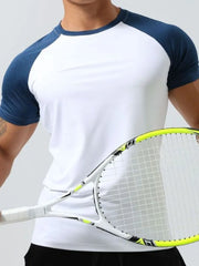White raglan sleeve performance tee with navy sleeves and collar, worn by a man holding a tennis racket.