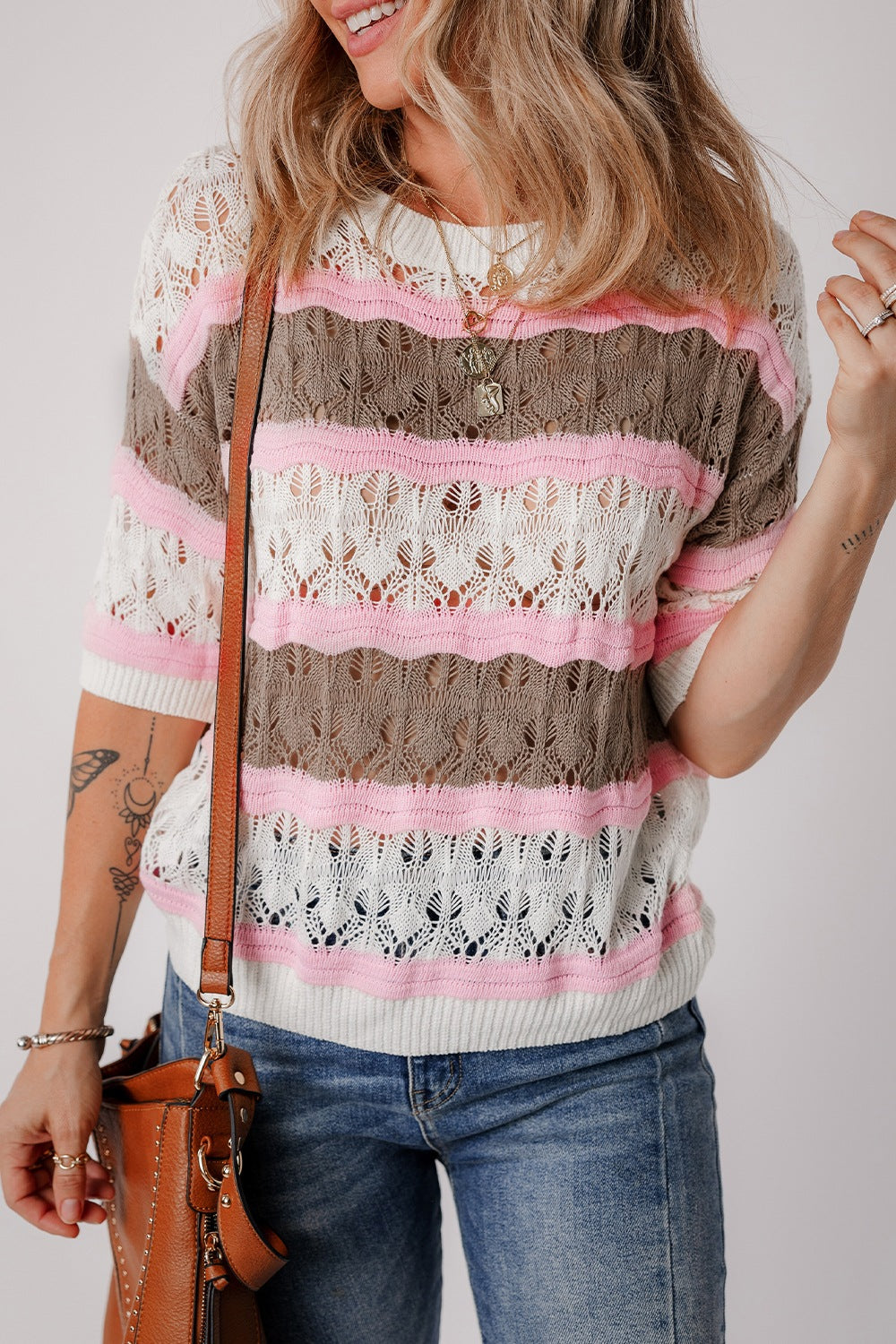 Striped openwork knit top with pink, taupe, and white stripes.