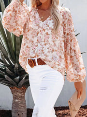 Floral print V-neck long sleeve maternity shirt with balloon sleeves.