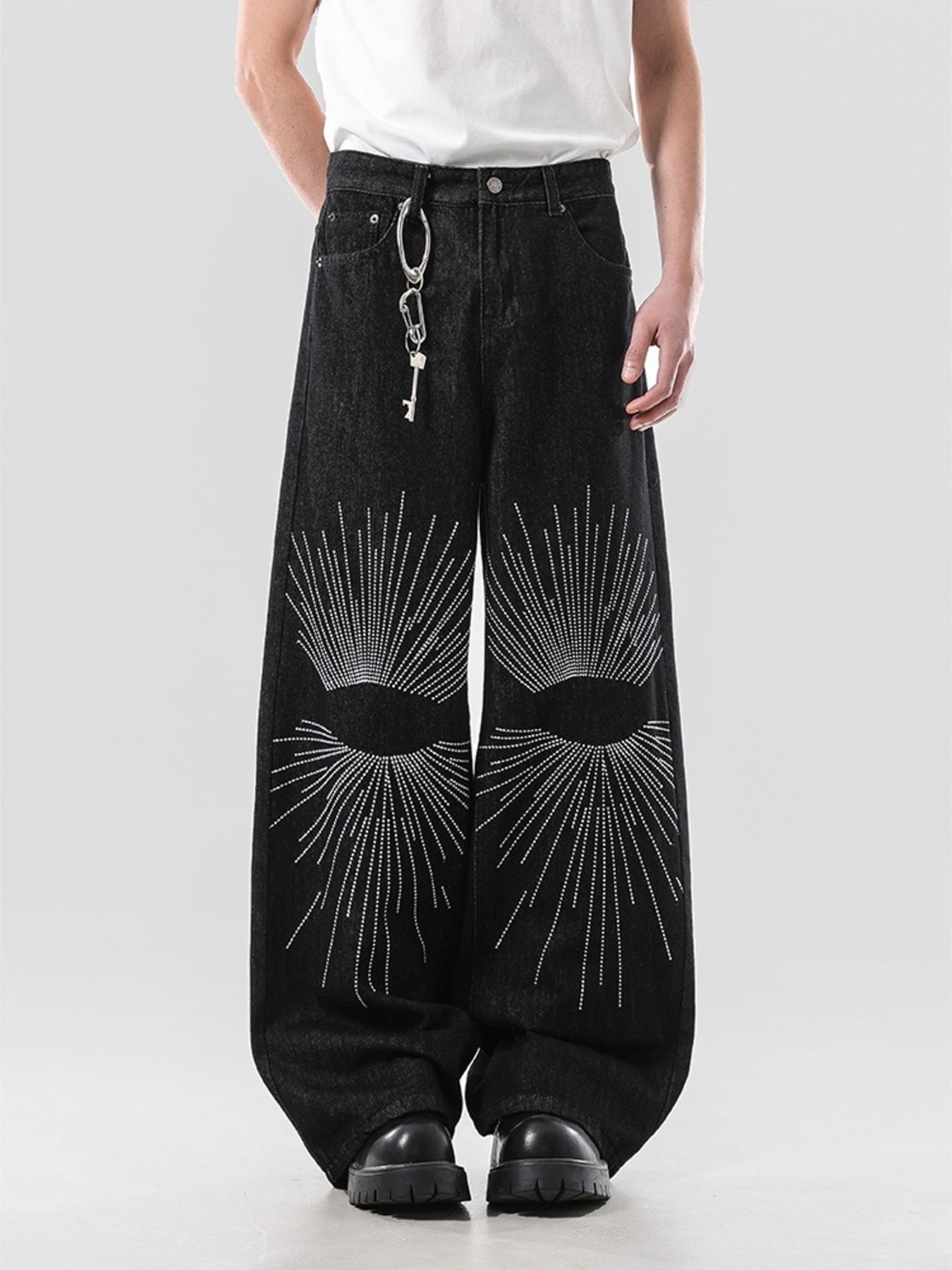 Men's dark wash wide leg jeans with embroidered sunburst detail and key chain.