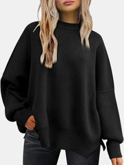 Black ribbed knit sweater with slouchy sleeves and mock neck.