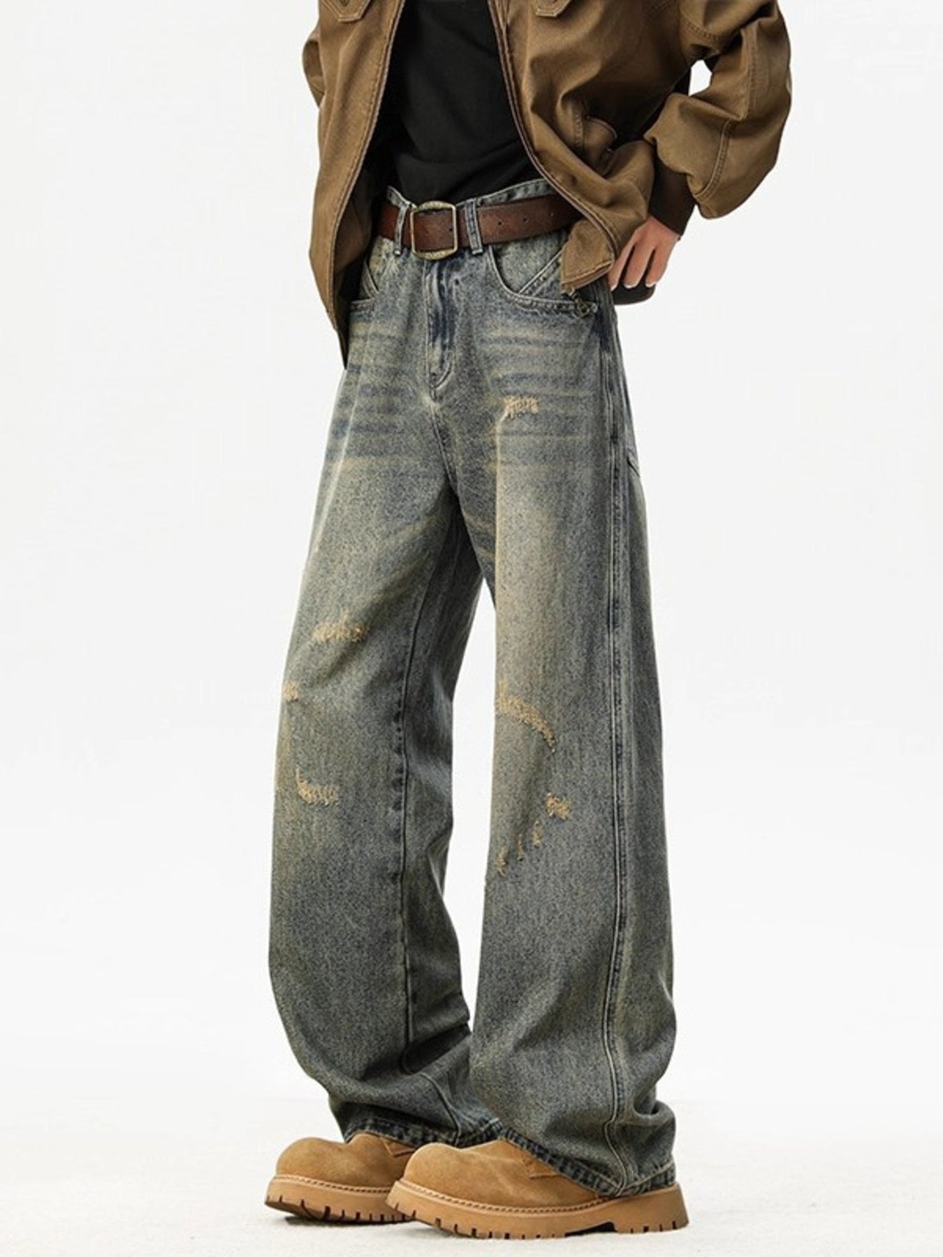 Distressed blue wide leg jeans in cotton with a relaxed fit.