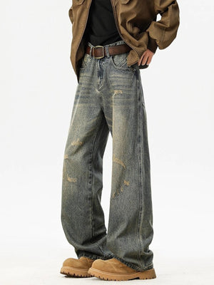 Distressed blue wide leg jeans in cotton with a relaxed fit.