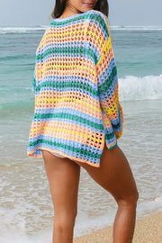 Crochet beach cover-up with horizontal stripes in turquoise, sherbet, and blue.