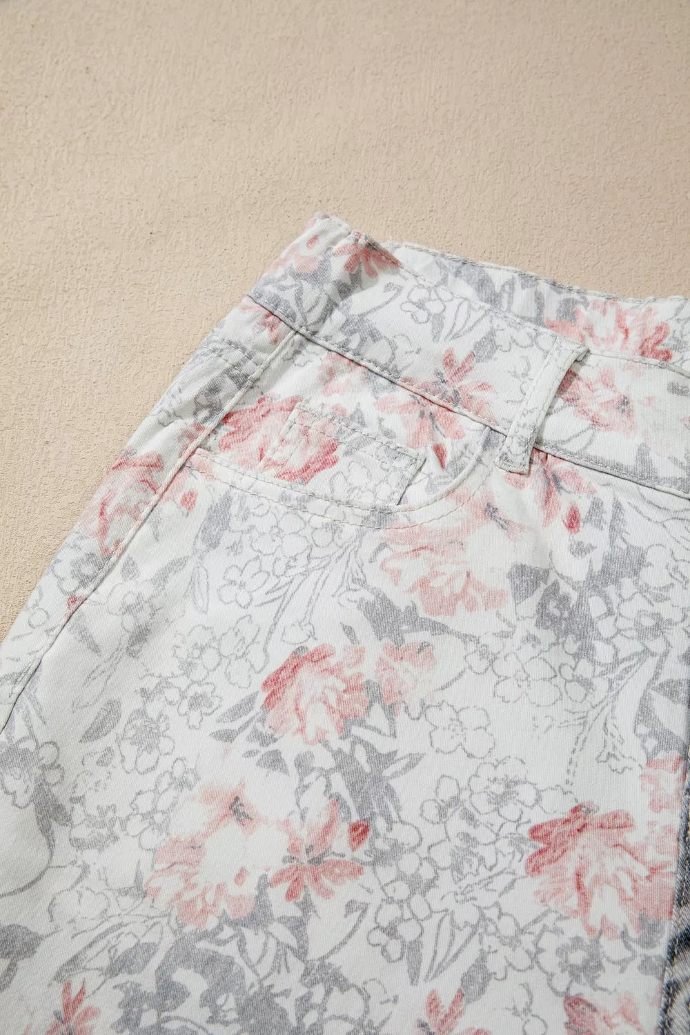 Floral print cotton jeans with a wide-leg cut and a cropped length.