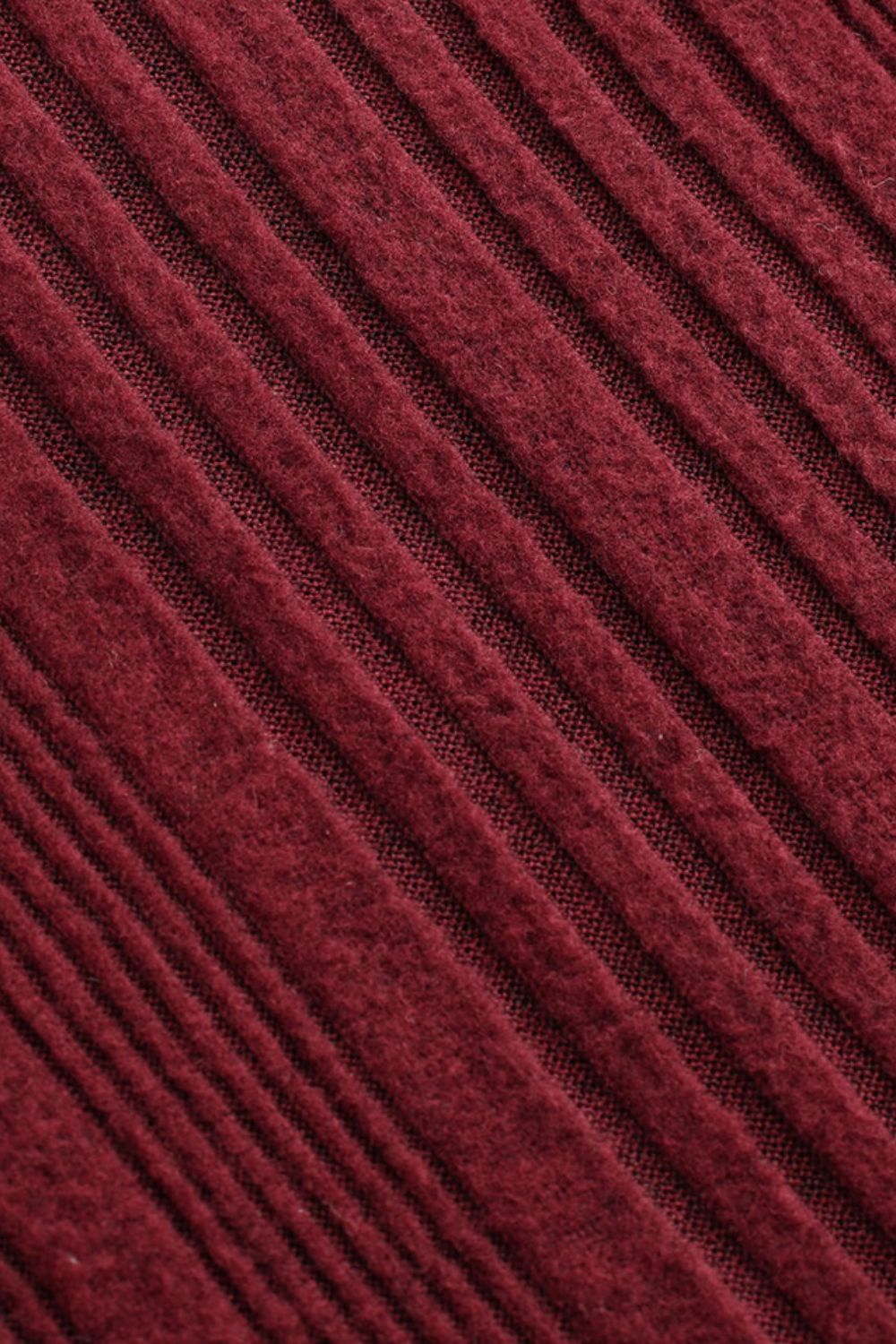 Deep Red ribbed bodysuit with a textured knit fabric detail.